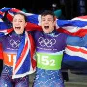 Tabby Stoecker and Matt Weston celebrate their gold medal (Andrew Milligan/PA).
