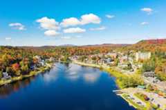 Colorful aerial view of Saranac Lake New York in the Adirondack Mountains.