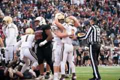 Football players celebrating after a play