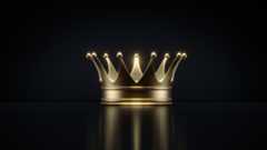 A shiny gold crown against a black background