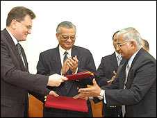 Officials sign the deal in Mumbai