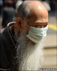 An elderly man wears a surgical mask in Hong Kong