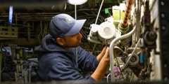 A Nolinor Aviation maintenance technician repairs a Boeing 737.