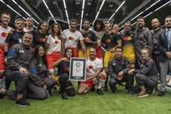 Explore case studies - group of record breakers with certificate