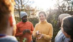 group image of a family running across the beach