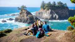 Hikers taking in views of the Pacific Ocean along Oregon’s Samual H. Boardman State Scenic Corridor