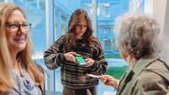 ticket-scanning A Virginia Tech student employee scans tickets before a performance.