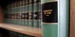 green bankruptcy law books on shelf