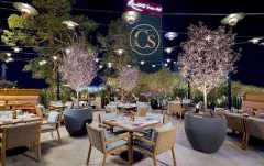 The beautiful patio seating area of Carversteak at Resorts World Las Vegas.
