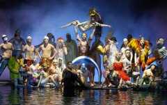 A group of performers posing on stage during the O show by Cirque du Soleil.
