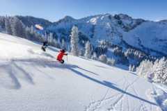 Skiers at Alta Ski Area in winter 2024