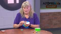 Mitsy making a ukelele craft