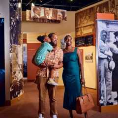 A Black family look at exhibits in the Lewis Museum