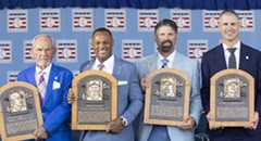 Jim Leyland, Adrian Beltré, Todd Helton and Joe Mauer holding Hall of Fame plaques
