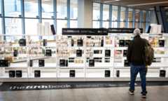 background image: Book shelves that have signage on it that says The Fifth Book