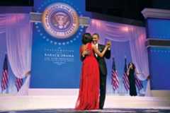 U.S. Pres. Barack Obama dancing with his wife, Michelle Obama, as Jennifer Hudson sings in the background at a ball for his second inauguration