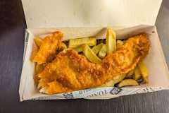 Man tastes London's cheapest fish and chips but points out 1 'problem' A Delicious Take Away Box Of Fish And Chips