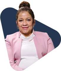 Angela richard eaglin v2 Angela richard eaglin in a pink blazer with modern background.