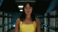 Lucy wearing a yellow dress and looking shocked in Fallout season 2 episode 7
