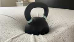 A 50lb weight balancing close to the edge of the Zinus Green Tea Memory Foam Mattress