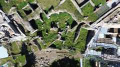 Aerial view of archaeological excavations in in Pompeii's Insula Meridionalis quarter.