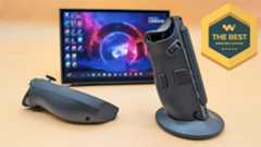 The Lenovo Legion Go 2 right controller in its FPS mode base with the let controller lying down. The Legion Go 2 is propped up on its kickstand behind them.