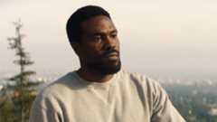 Simon Williams looking at an off-camera Trevor Slattery in Marvel's Wonder Man