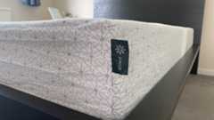 A closeup of the Zinus Green Tea Memory Foam Mattress showing the Zinus label