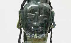 Green figure head glazed ceramic art piece