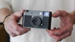 Fujifilm X half compact camera in the hand