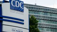 Bullet holes are seen in windows at the Centers For Disease Control Global Headquarters following a shooting