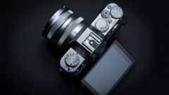 Fujifilm X-T30 II from above on a dark gray surface with low key lighting