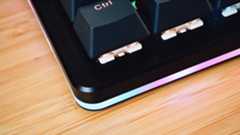 A black Drop CTRL V2 keyboard on a wooden desk