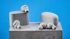 Sony WF-1000XM6 earbuds photographed in front of a blue background