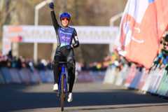 Dutch Lucinda Brand celebrates as she crosses the finish line to win the women elite race at the World Cup cyclocross cycling event in Tabor, Czech Republic, stage 1 (out of 12) of the UCI World Cup cyclocross competition, Sunday 23 November 2025.BELGA PHOTO DAVID PINTENS (Photo by DAVID PINTENS / BELGA MAG / Belga / AFP via Getty Images)