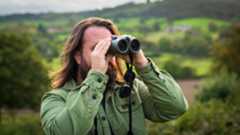 Expert holds one of the best binoculars while observing