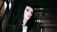 Harpy sitting on some steps