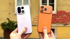 The OnePlus 15 being held up next to the iPhone 17 Pro