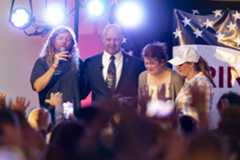 Singer Sean Feucht, left offers prayers as Pa. Sen. Doug Mastriano, winner of the Republican gubernatorial nomination, his wife Rebecca, and Jenna Lynn Ellis, right, bow their heads at his watch party held at The Orchards in Chambersburg on May 17, 2022.Joe Hermitt | jhermitt@pennlive.com
