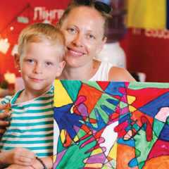 A mother and son display art they made during a therapy session at New Hope. — Courtesy of New Hope