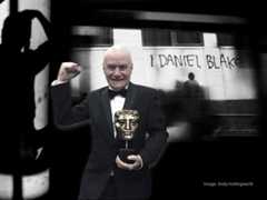 Dave Johns holding BAFTA award for 'I Daniel Blake'