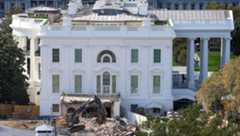 An excavator works to clear rubble on Oct. 23 after the East Wing of the White House was demolished.