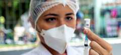 A nurse prepares to administer a COVID-19 vaccination northern Brazil. A nurse prepares to administer a COVID-19 vaccination northern Brazil.
