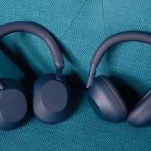 sony xm6 and xm5 headphones on couch