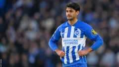 Mahmoud Dahoud stands with his hands on his hips