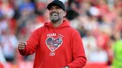 Klopp wore a top with the words 'I'll Never Walk Alone Again' on the back