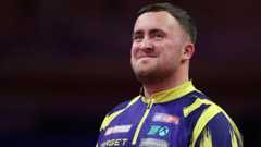 Luke Littler smiling