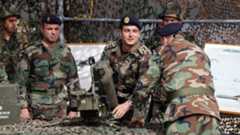 Lebanese army soldiers inspect a Milan anti-tank missile launcher during a hand-over ceremony for a shipment of French weapons at Beirut international airport (20 April 2015)