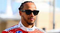 Lewis Hamilton pictured wearing sunglasses in his Ferrari race overall at the Bahrain pre-season test