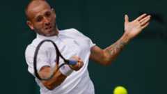 Dan Evans in action at Wimbledon